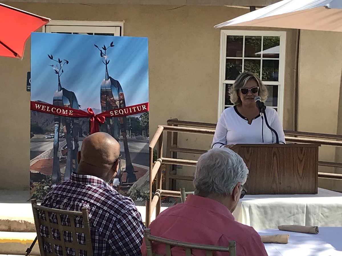 CityofIndio's tweet photo. Indio Mayor Lupe Ramos Amith dedicates new #Sequitur public art work by Heath Satow on Jefferson St in front of #ShieldsDateGarden. #OnlyInIndio https://t.co/rlPH2aq3QX