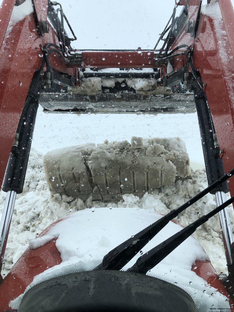 T_Bartman's tweet photo. When the snow is so dense it just falls out of the bucket and holds its shape #Harvest19 #Storm19 https://t.co/HTPKoKCklC