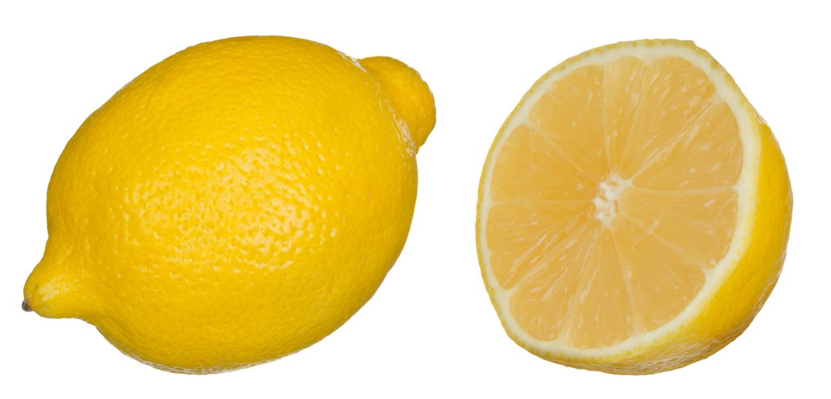 Two lemons - one whole, one cut in half. By Evan-Amos from Wikimedia Commons.
