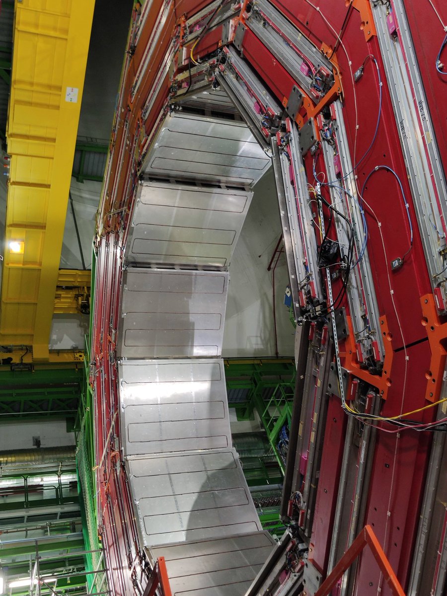 RayzorJo's tweet image. I got to visit the #CMSexperiment during #cernopendays. Vibrantly  colored, serpentine cables, foil endcaps and barrels--reminiscent of a lunar lander. It was like being in a SciFi movie. Awesome. #LHC #CERN @CMSExperiment