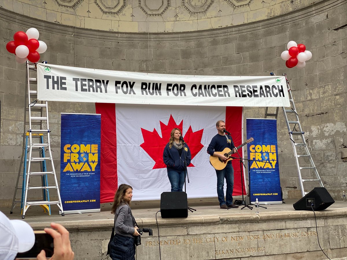 David Hein and Irene Sankoff performing on stage at the Terry Fox Run.