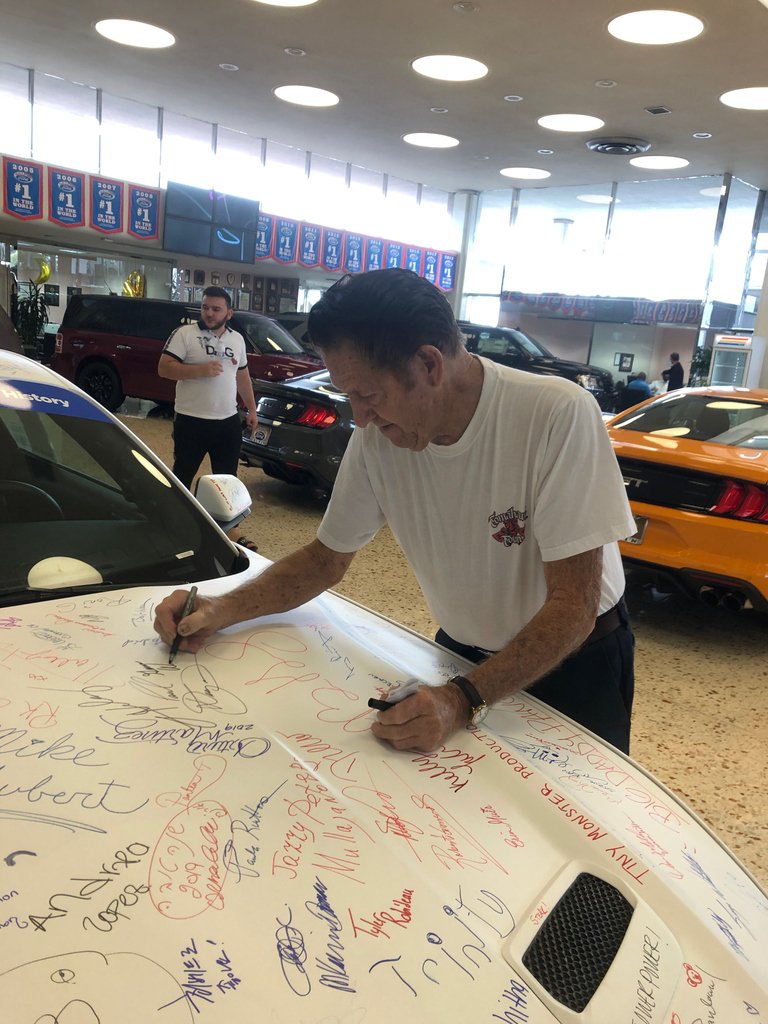 Galpinford's tweet photo. Another one! Legendary car customizer, #genewinfield made history by adding his John Hancock to the Signature Pony! Winfield stopped by and purchased 3 new vehicles allowing Galpin Ford to take one step closer to becoming the #1 Ford dealership in the world for 30 years in a row! https://t.co/p4j12wi7ia