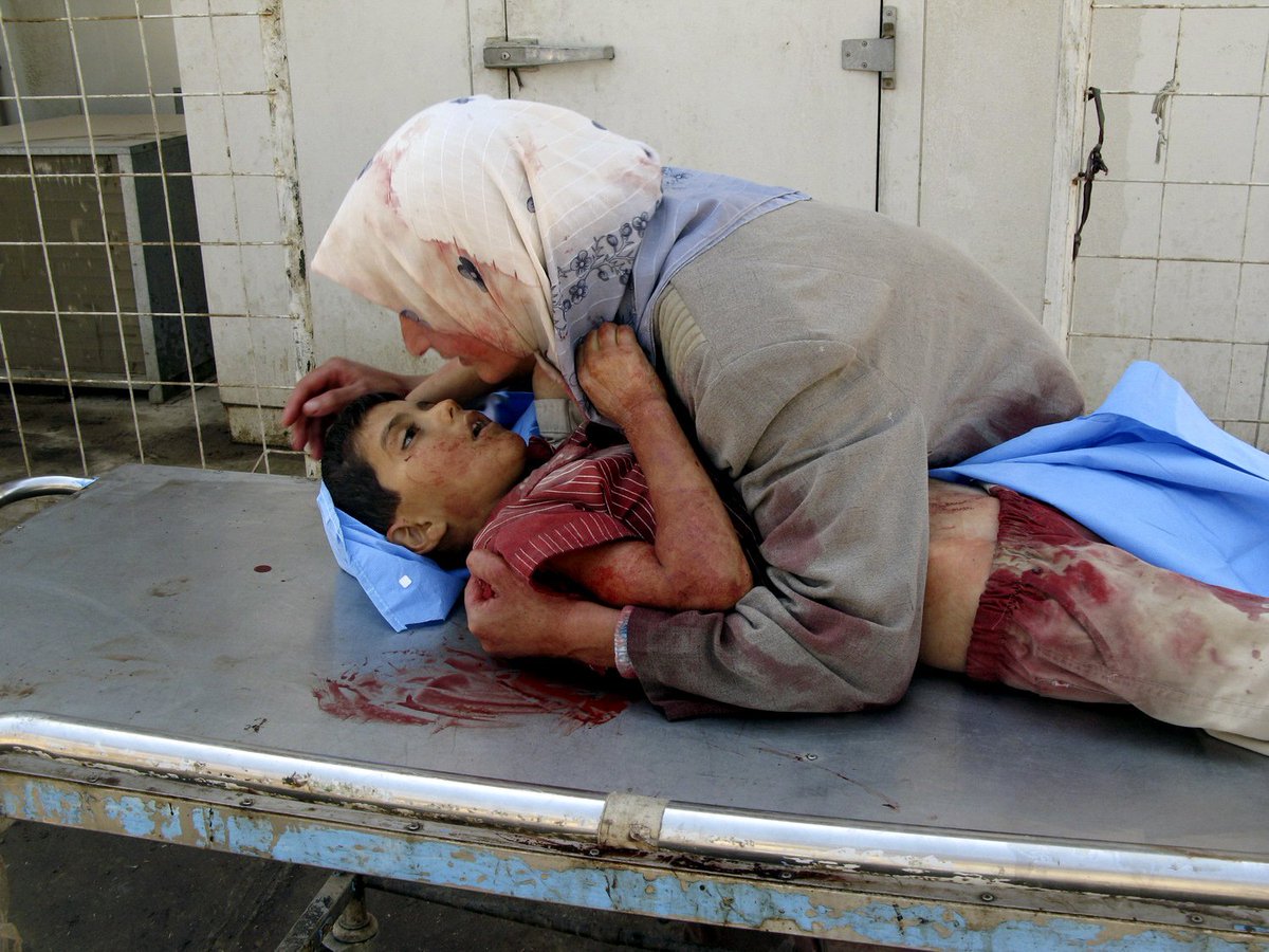 Mother loses her 6 year old son to drive by shooting in Baqouba, Iraq. 2007