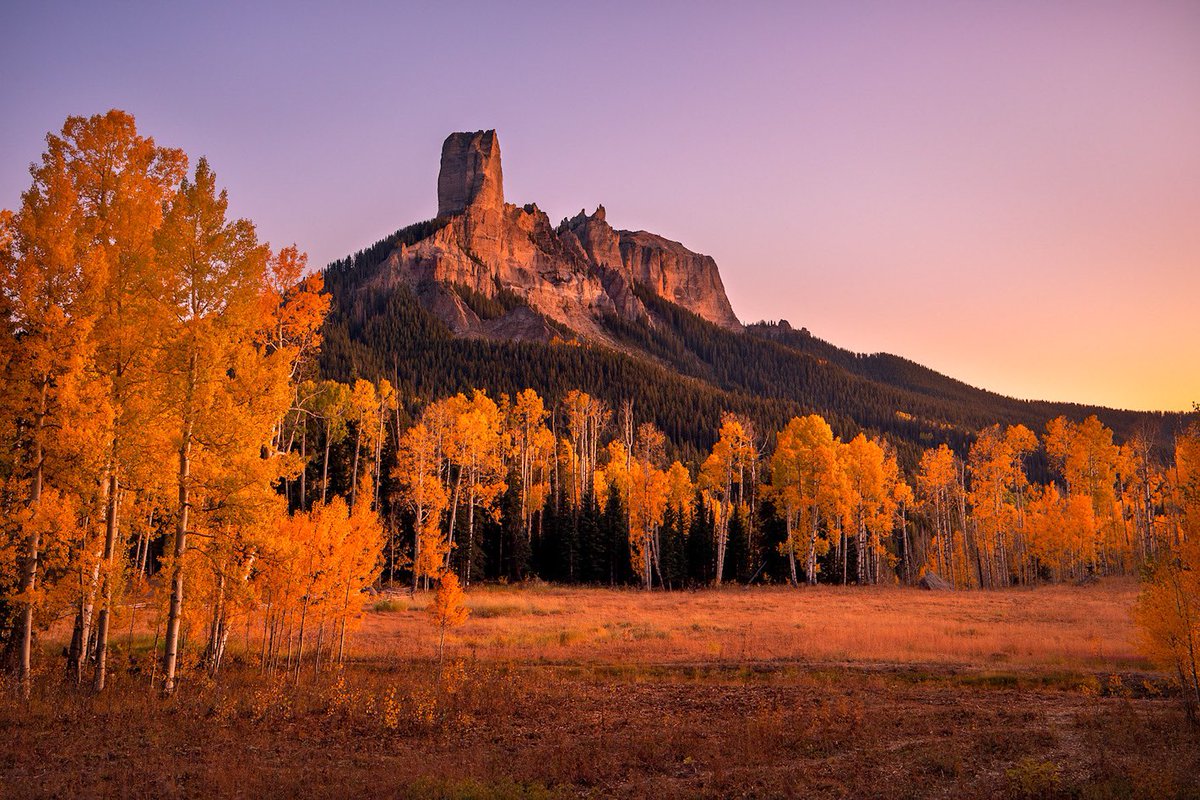 "<a href="/SirlinJohn/">John Sirlin</a>: Sunset light illuminates the golden Aspen trees surrounding Chimney Rock in Owl Creek Pass, Colorado. #cowx #fallfoliage"