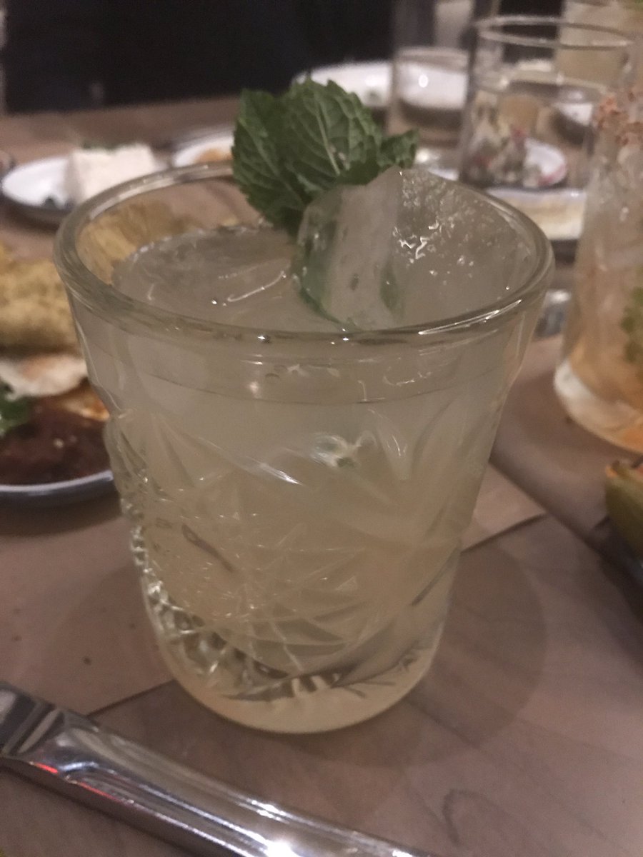 nancytrejos's tweet photo. Epic dinner at @lamalonyc at #ArloNomad. Middle Eastern fare including this incredible looking cabbage shank (love the knife in it), octopus, tender short ribs, all sorts of mezze (not pictured) and this cocktail with Arak, which I used to drink in Beirut. @ArloHotels https://t.co/ngK0jMddjp
