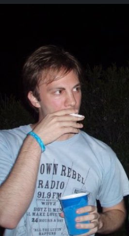 Me smoking a cigarette with a solo cup and wearing a t-shirt for this pirate radio station in Montclair NJ that only played one Boyz II Men song all day every day.