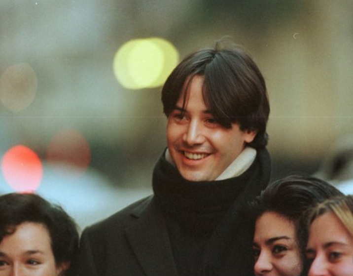 keanu reeves walking around london in a neck brace (1997)