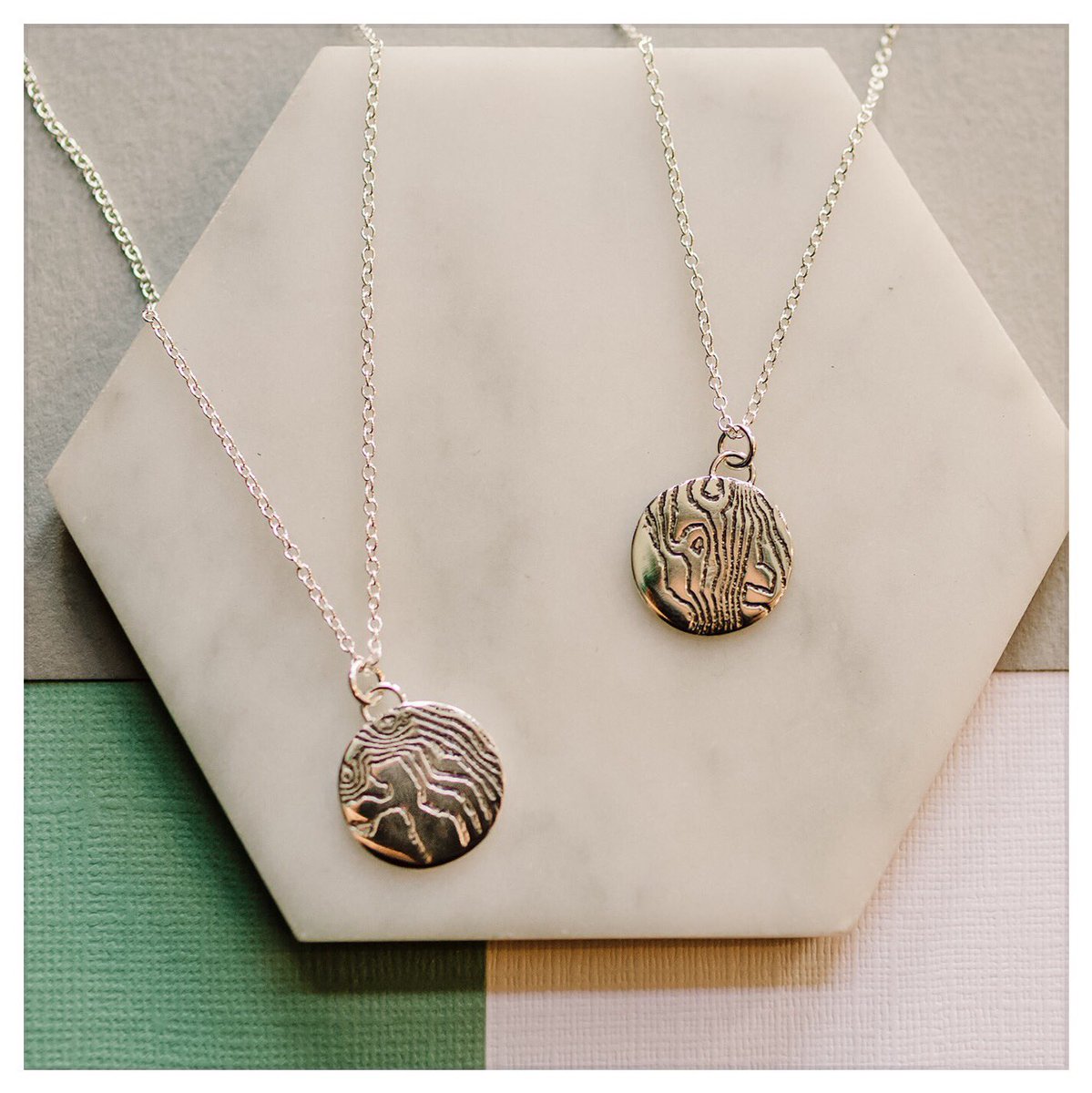 _GMcGuinness's tweet photo. @TheoPaphitis #SBS Working from my workshop which is set up in my spare bedroom, I design and make jewellery inspired by travel and special places. I create personalised items by acid etching maps of meaningful locations onto the metal. I use sterling silver and 18ct gold plate. https://t.co/SyJ424uTBy