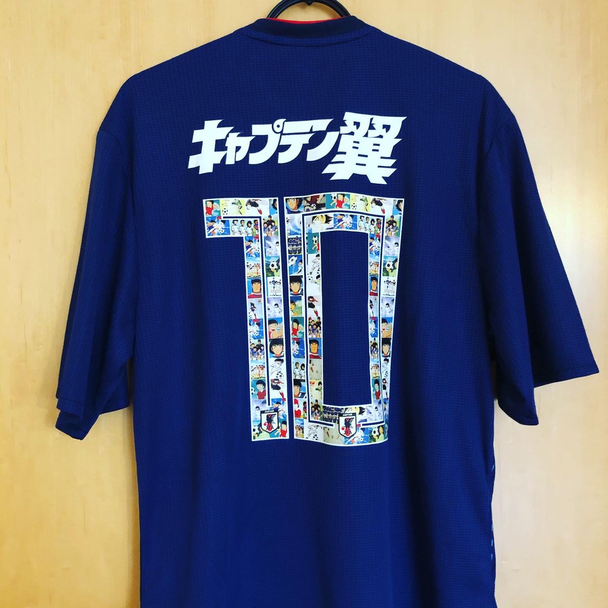  @japanfootball_a Home Kit, 2018AdidasPersonalised: キャプテン翼, 10Did anyone say international break? This (fake) replica of Japan’s 2018 World Cup shirt celebrates popular manga series “Captain Tsubasa”. The pretty cool numbering contains stills from the cartoon.