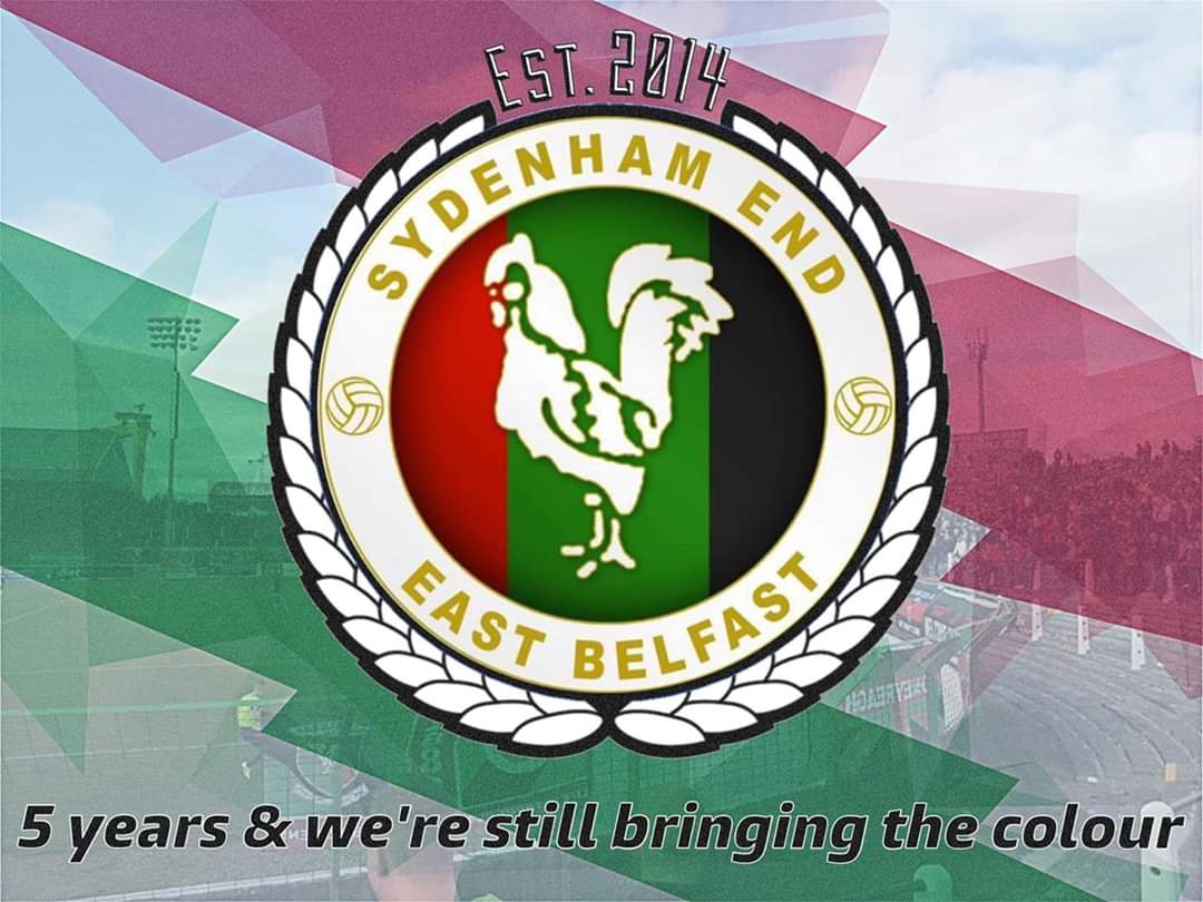 Glentoran's tweet photo. 📸👏 | 5 years since the Sydenham End started to bring the colour to The Oval and away games.

A phenomenal amount of flags have been made by our fans over the years and we we can only praise Glentoran Sydenham End for their time, effort and commitment! #TimeToClimb 💚🐓 https://t.co/8FhGm0OAPR