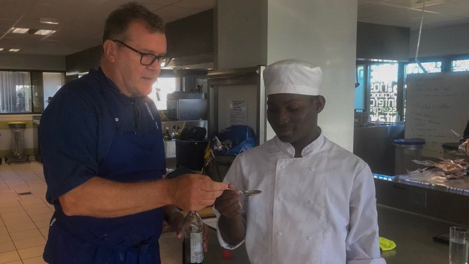 NigelHaworth's tweet photo. I had a fantastic time with students at the college in Nîme last week 👨‍🍳 
This is Yaya, he was a great help while we cooked Sea Bass with Sorrel.
#CookingCollege #ChefOnTheMove #SeaBass https://t.co/5zxQMNXL2v