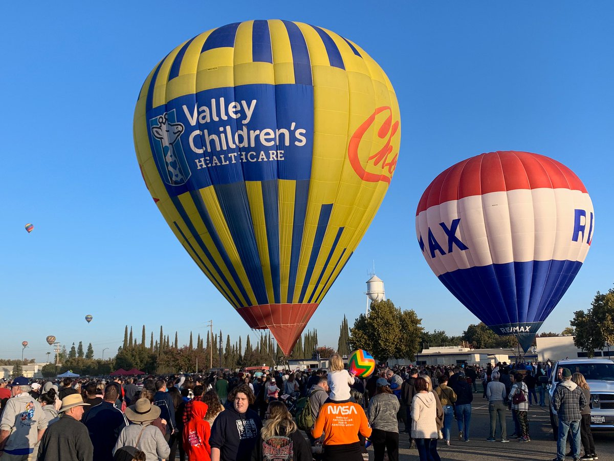 thefeather's tweet photo. With the hot air balloon #funfly liftoff, #ClovisFest officially opens in @OldTownClovis! Come join #thefeather for an old fashioned #streetparty! Come for the food, hundreds of booths, games for the kids! #oldtownclovis @remax @CareForKids https://t.co/t7cFT3AiCq