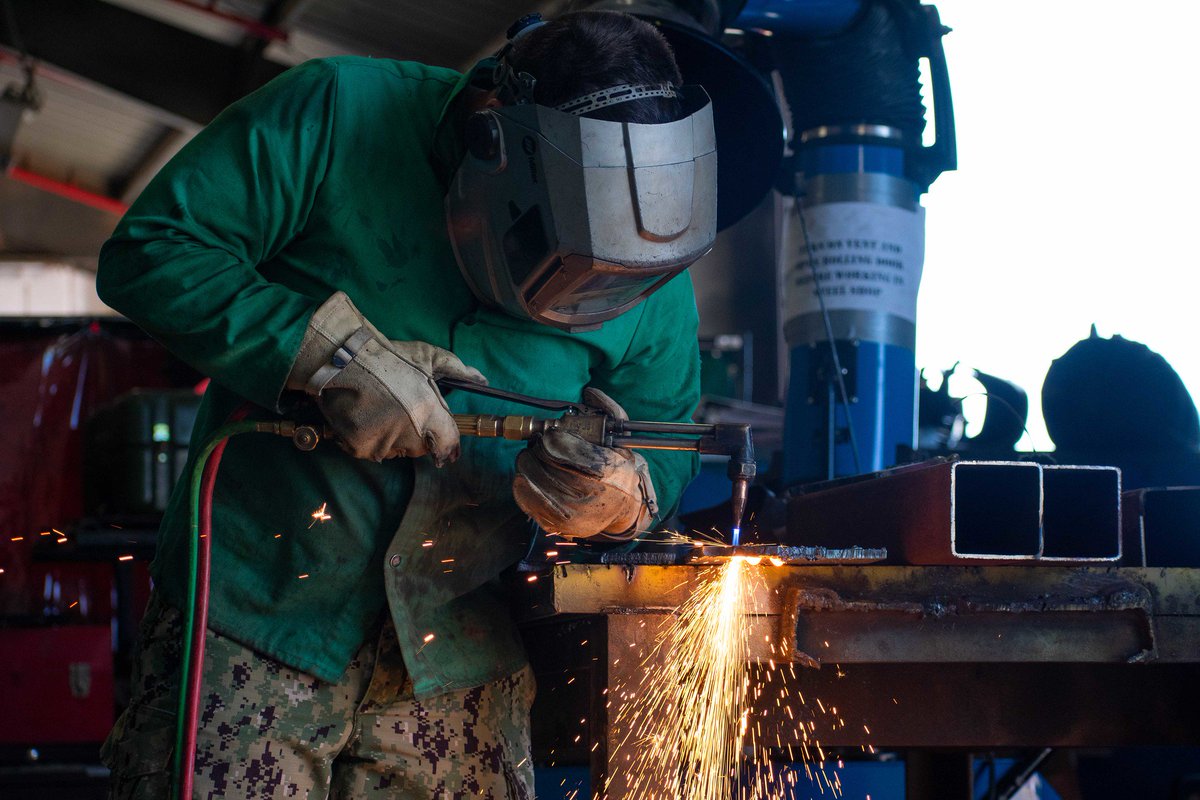 Builder 3rd Class Humberto Enriquez, assigned to Naval Mobile Construction Battalion 11 practices cutting with an oxy-acetylene torch at Naval Station Rota, Spain. #NMCB11 #NavyReadiness