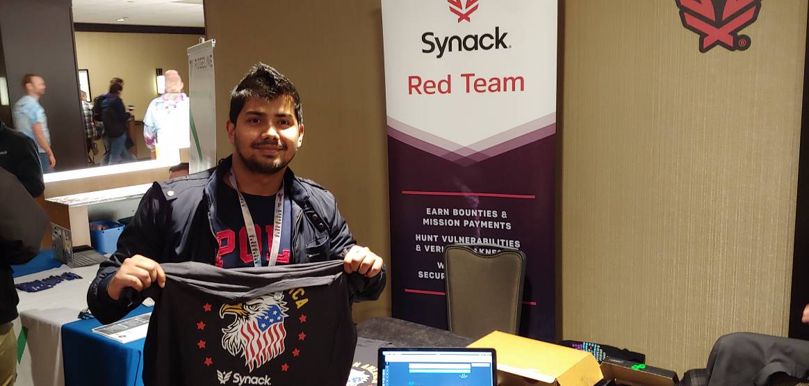One of the Synack CTF participants with his T-shirt prize here at @BsidesDC : @jazz1nat0r
