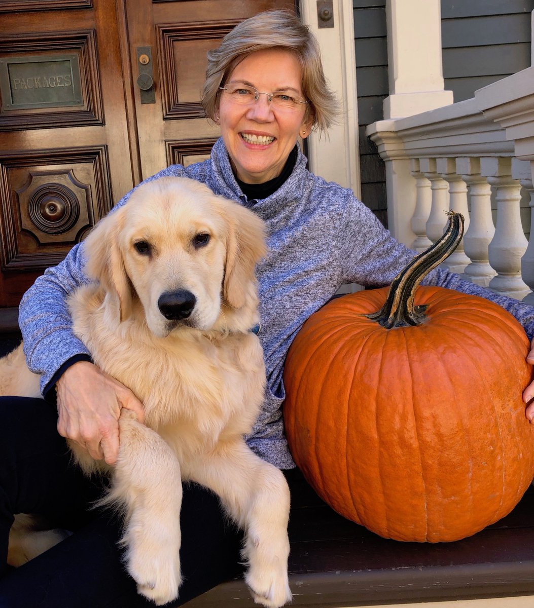 Bailey and Elizabeth Warren pose with a pumpkin.
