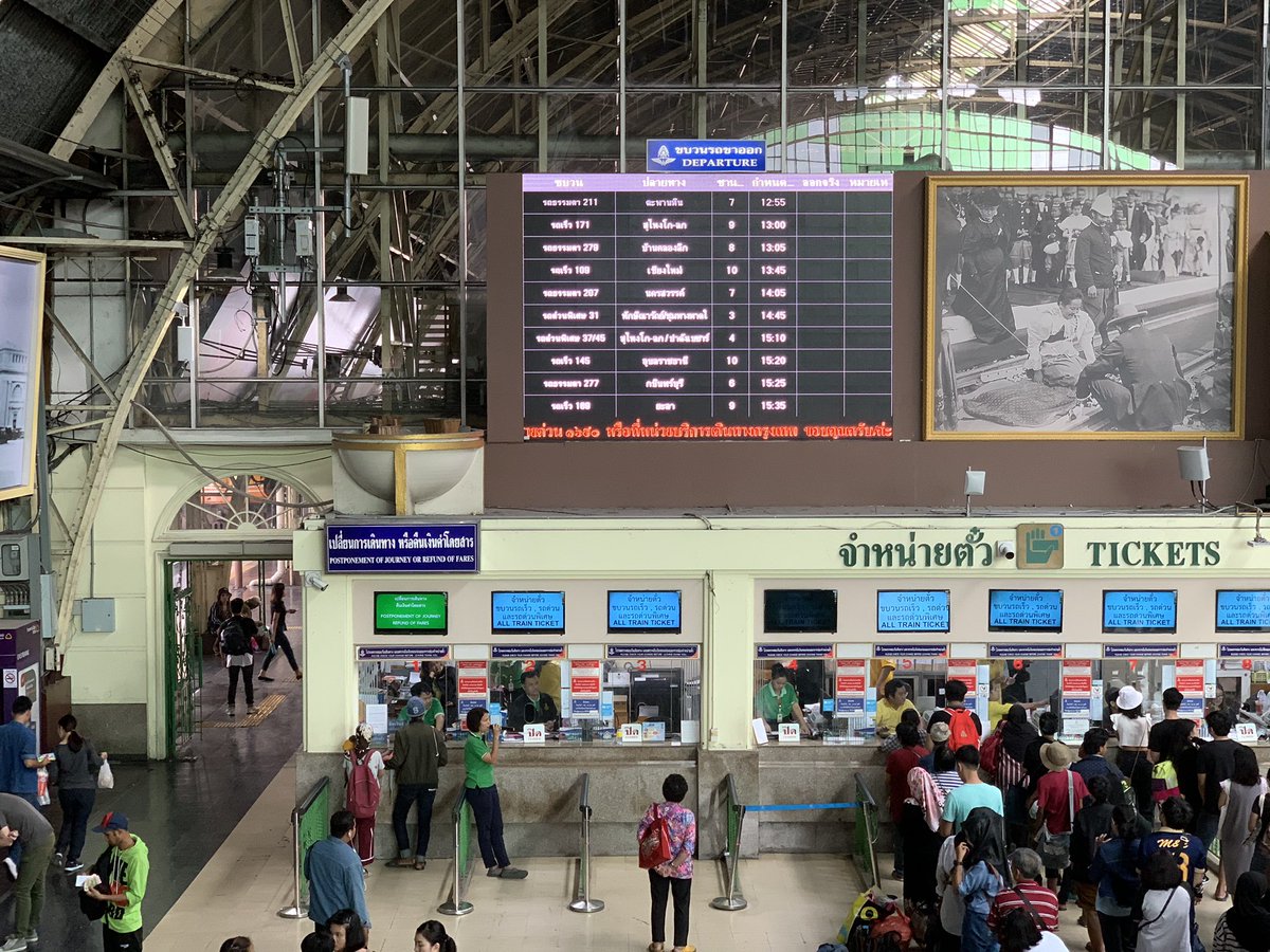 A view of the ticket counters. The information is displayed in Thai and English.