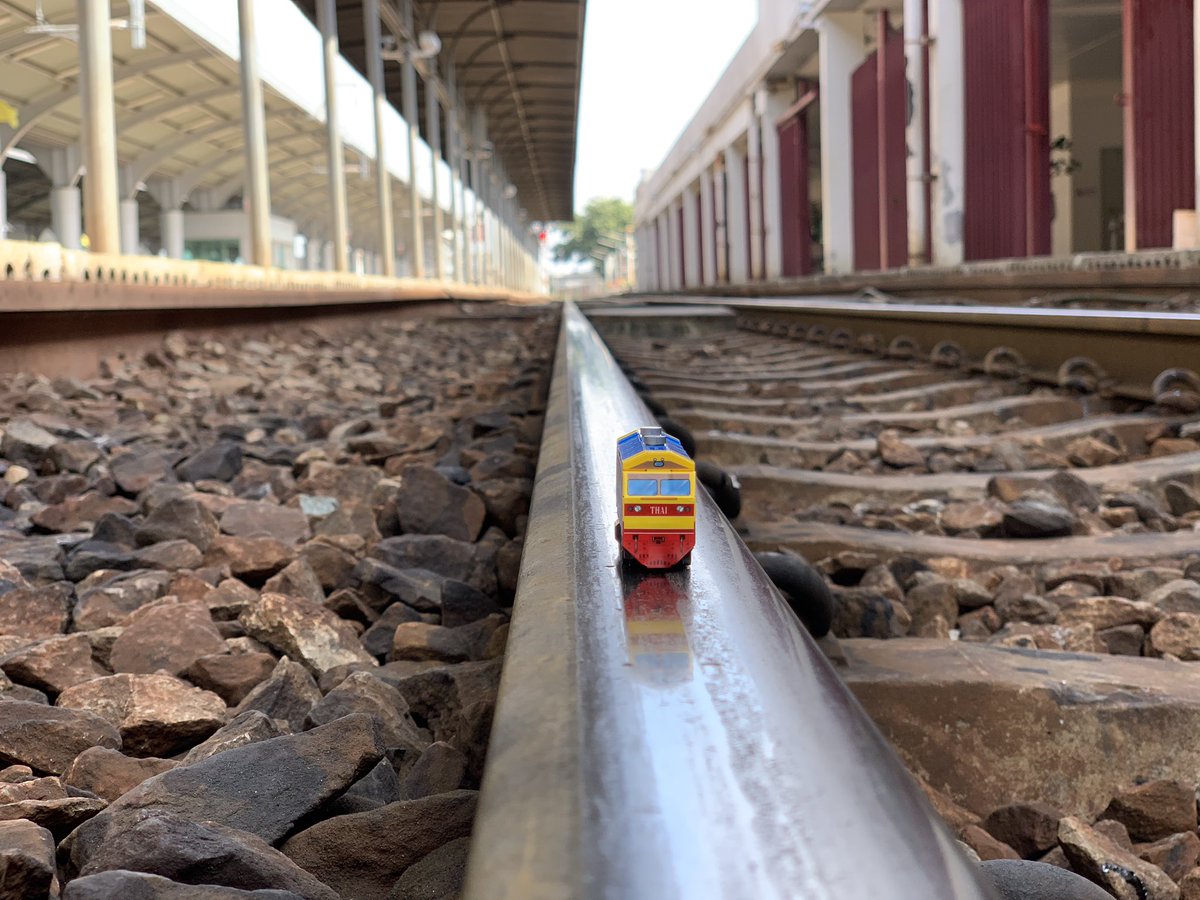 Here is the toy locomotive sitting on the track at Taling Chan Junction. Fun stuff and photographing it. My train to Kanchanaburi could just be seen coming. &ndash; bei  สถานีตลิ่งชัน (Taling Chan) SRT4004/SRT Light Red Line