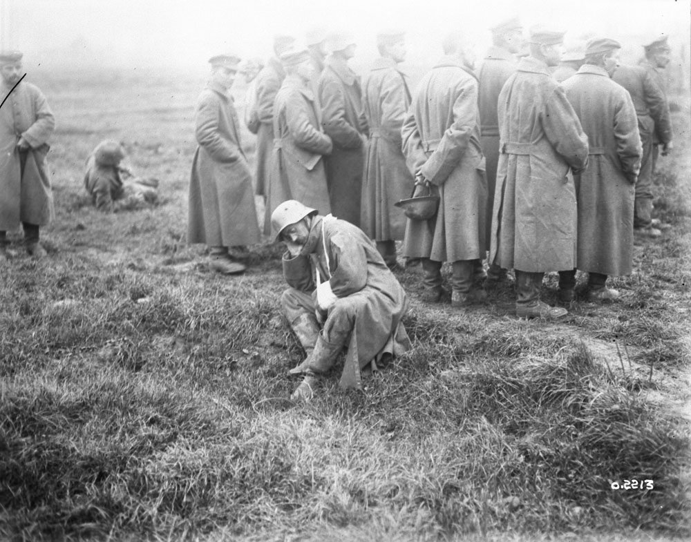 Boche prisoners waiting for a strafe to finish before proceeding to the prisoners' cage, November 1917, LAC MIKAN 3403145.