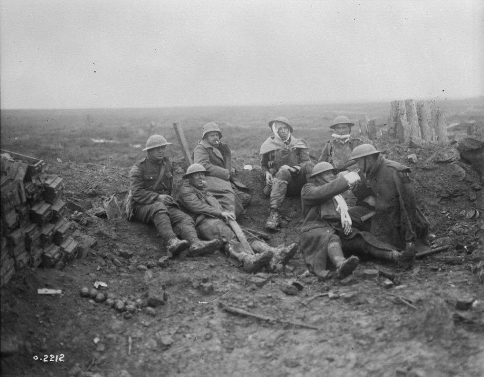 Wounded Canadians rest near Heine pill-box. Battle of Passchendaele, November 1917, LAC MIKAN 3397041.