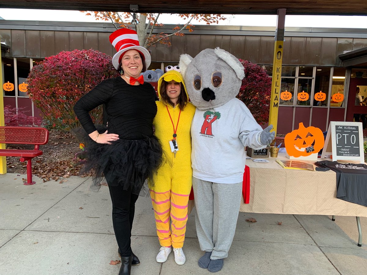 Ms. Leveque, Mrs. Iozzo, and Mrs. Adamo greeting students at the Halloween Bash last night!