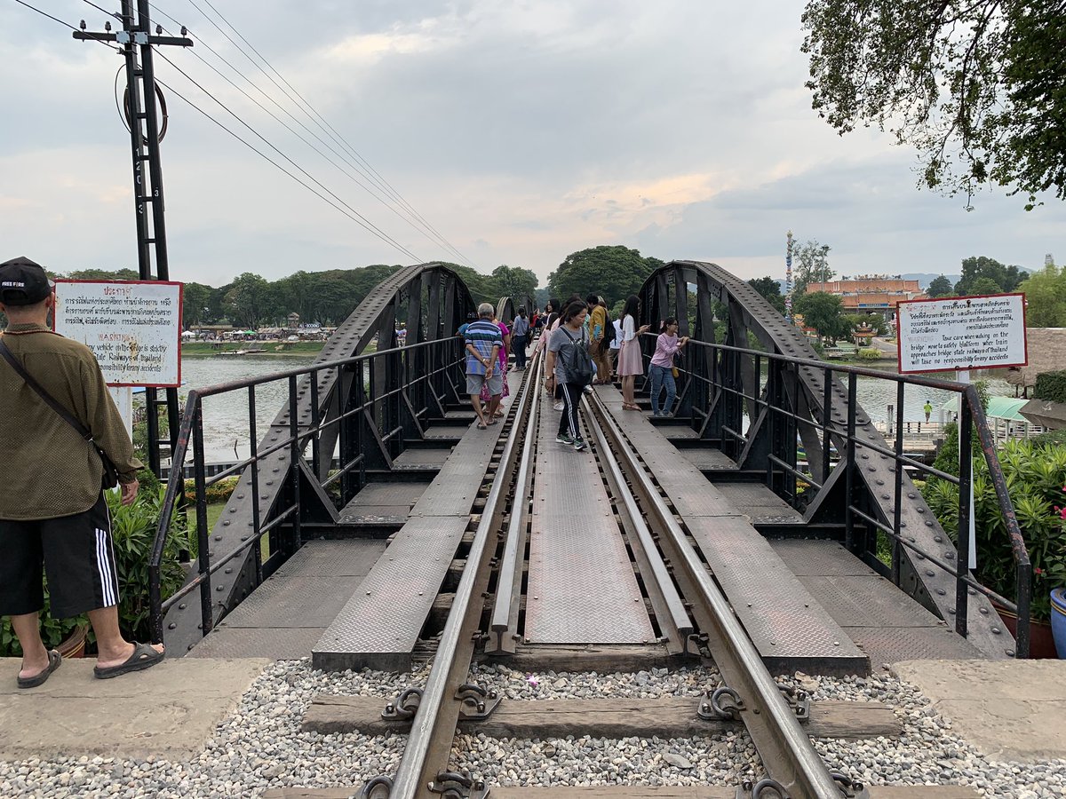 Starting from Kanchanaburi side, the bridge has arched trusses that give way to flat ones. The flat ones were installed after the Allied bombing. Strangely enough, the builder’s plate read: “Yokogawa Bridge Works: Tokyo, Japan”. &ndash; bei  สะพานข้ามแม่น้ำแคว (The Bridge of the River Kwai)