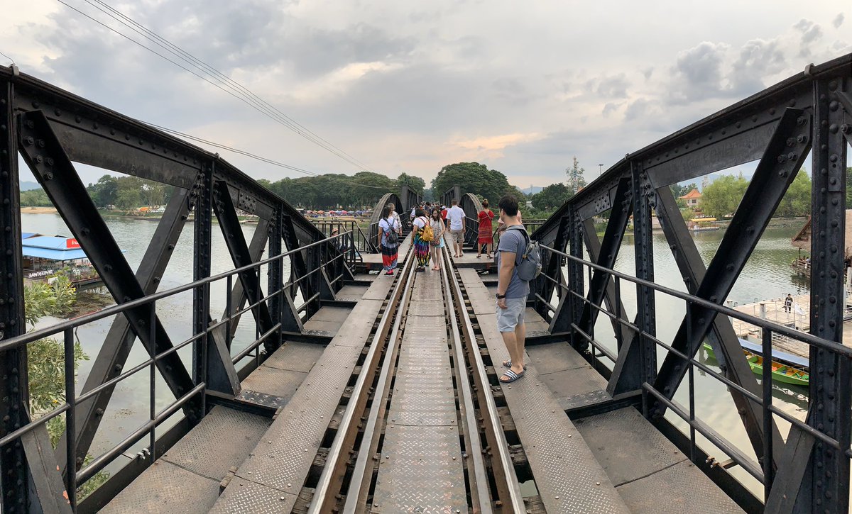 Starting from Kanchanaburi side, the bridge has arched trusses that give way to flat ones. The flat ones were installed after the Allied bombing. Strangely enough, the builder’s plate read: “Yokogawa Bridge Works: Tokyo, Japan”. &ndash; bei  สะพานข้ามแม่น้ำแคว (The Bridge of the River Kwai)