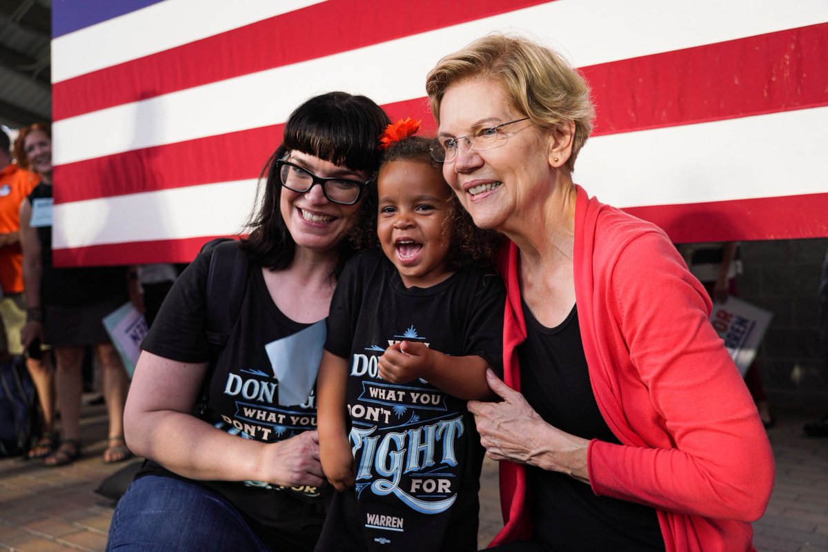Elizabeth Warren poses with a family at the Florence, South Carolina town hall.
