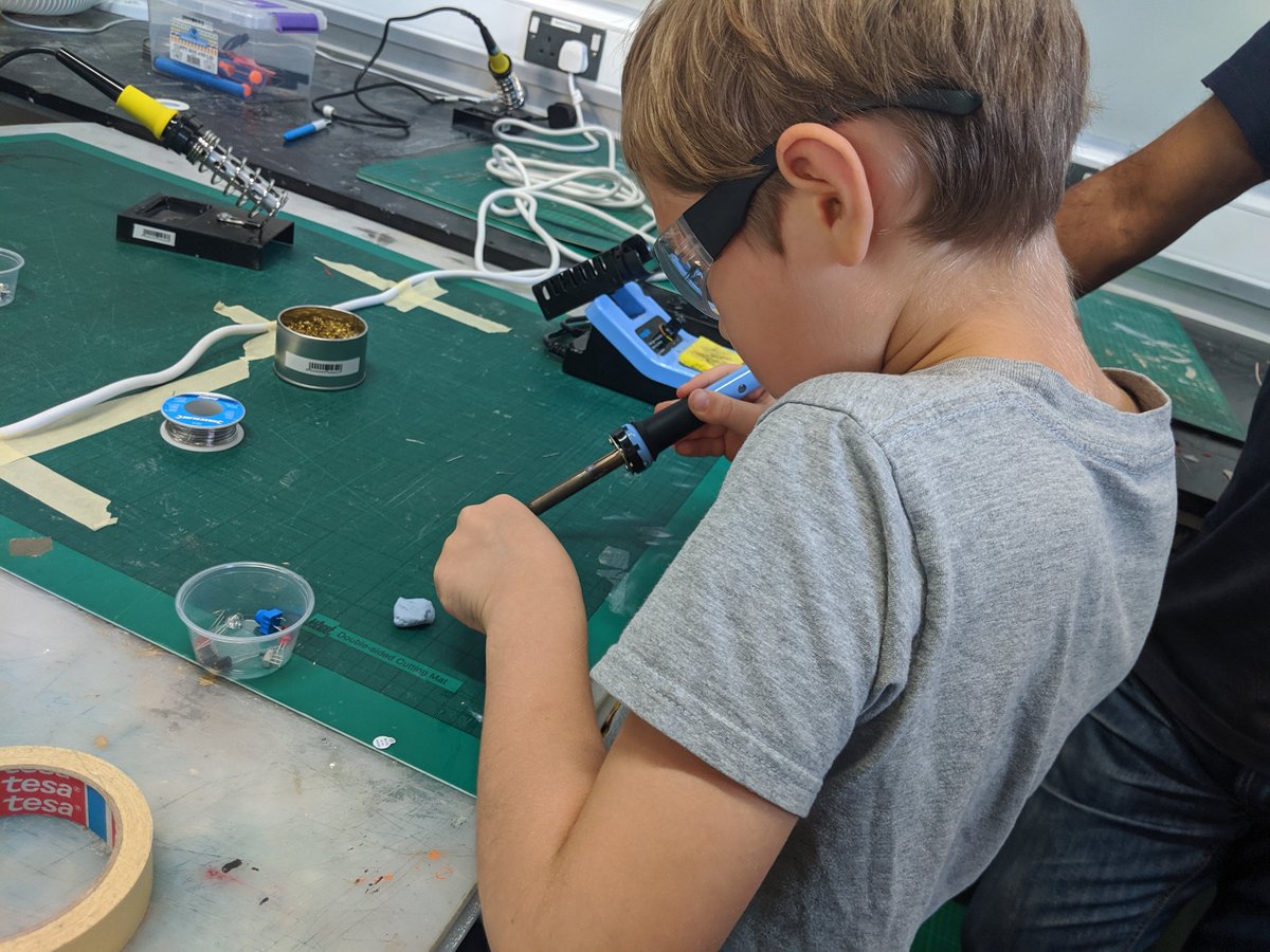One of my favourite bits of #MozFest was watching Owen learn to solder (and another was the Human Patterns game tucked away in the #YouthZone which had us all in stitches)