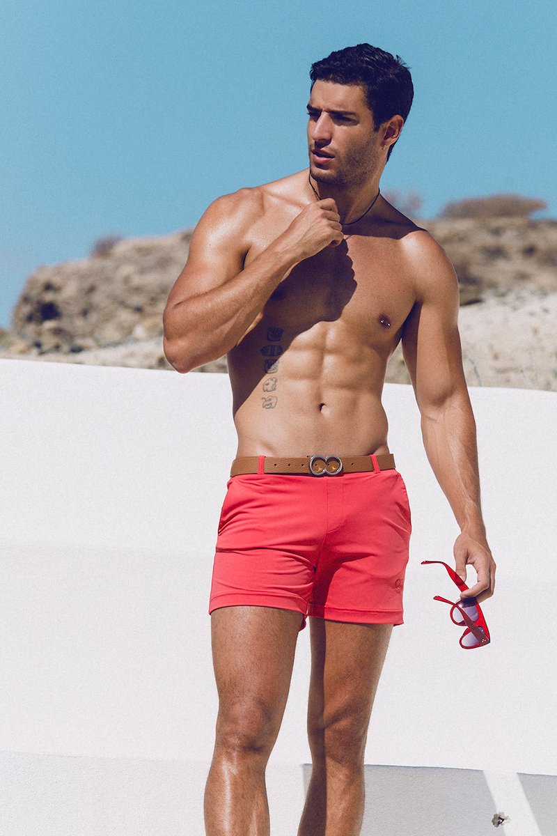 Model Carlos Gomez in the Grid swim shorts of teamm8 posing for