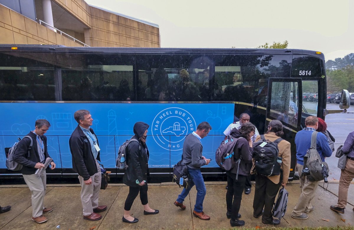 UNC's tweet photo. The #TarHeelBusTour has officially hit the road! 🚌

About 90 Carolina faculty members and senior leaders will crisscross our state today through Friday to connect with and learn from the communities #UNC serves 💙 https://t.co/VJ0dOUqGeV