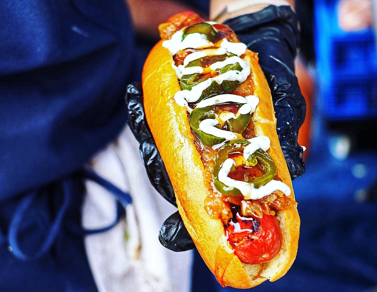 Have you tried <a href="/swizzlerfoods/">Swizzler Crispy Chicken + Smash Burgers</a> Feast Mode, a hotdog w/ caramelized onions, whipped goat cheese, candied jalapeños, and black pepper honey? You’ll need extra tastebuds to handle all the flavor. 🍯 Here with us at <a href="/smorgasburgdc/">Smorgasburg DC</a> for two more Saturdays! #gourmethotdogs