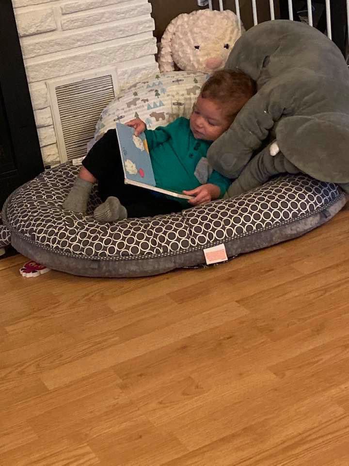 Sometimes you just wanna snuggle with your favorite stuffed animals and read a good book! Btw, early ASL acquisition is a strong predictor of English literacy in deaf children (Allen, 2015). #Miles #DeafBaby #LanguageAcquisition