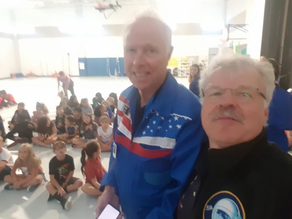 Cosmonauts Greg and Reinhold at work with the children of Ed White Elementary School El Lago, TX on community day XXXII ASE Planetary Congress #ase32