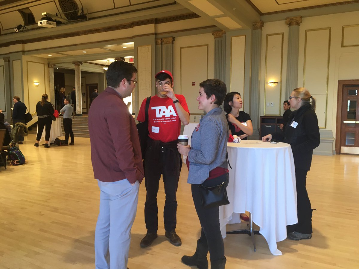 TAA_Madison's tweet photo. TAA members attended today's Shared Governance Reception &amp; talked w/ Vice Chancellor Heller about getting back to the table. Our commitment to shared governance has never wavered, even as we've been shut out of talks about our policies. Your move, UW. #ActionNotPromises https://t.co/vmp8uBbNIQ