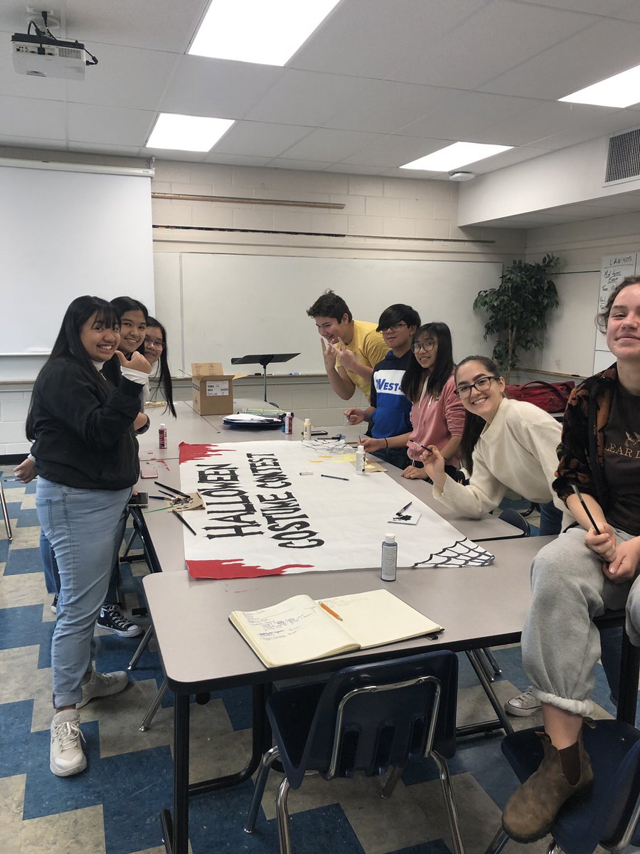 Student Council hard at work! Look out for our Halloween banner! 🎃👻