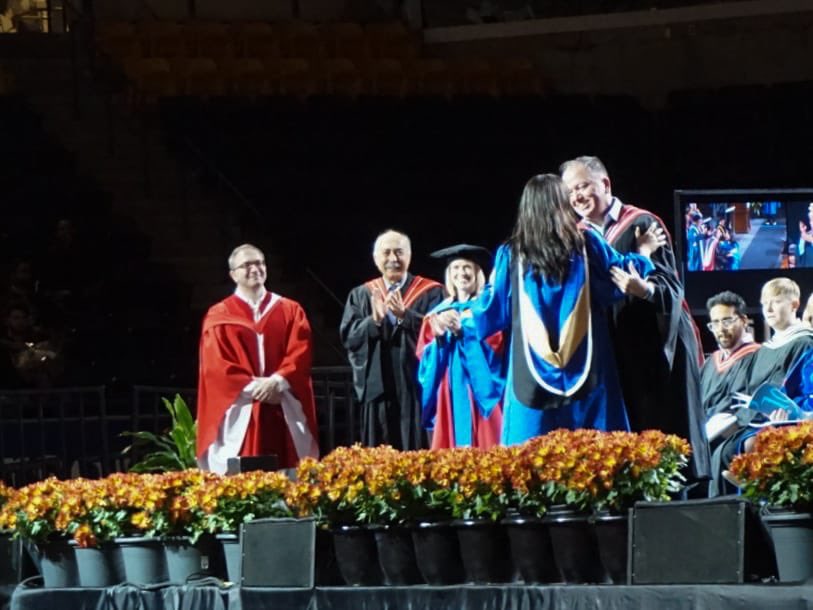 RUconvo's tweet photo. We were able to capture this beautiful moment of a graduate being congratulated on stage by her uncle✨
#RUConvo #Ryerson #Convocation https://t.co/jHDhUVkdq0