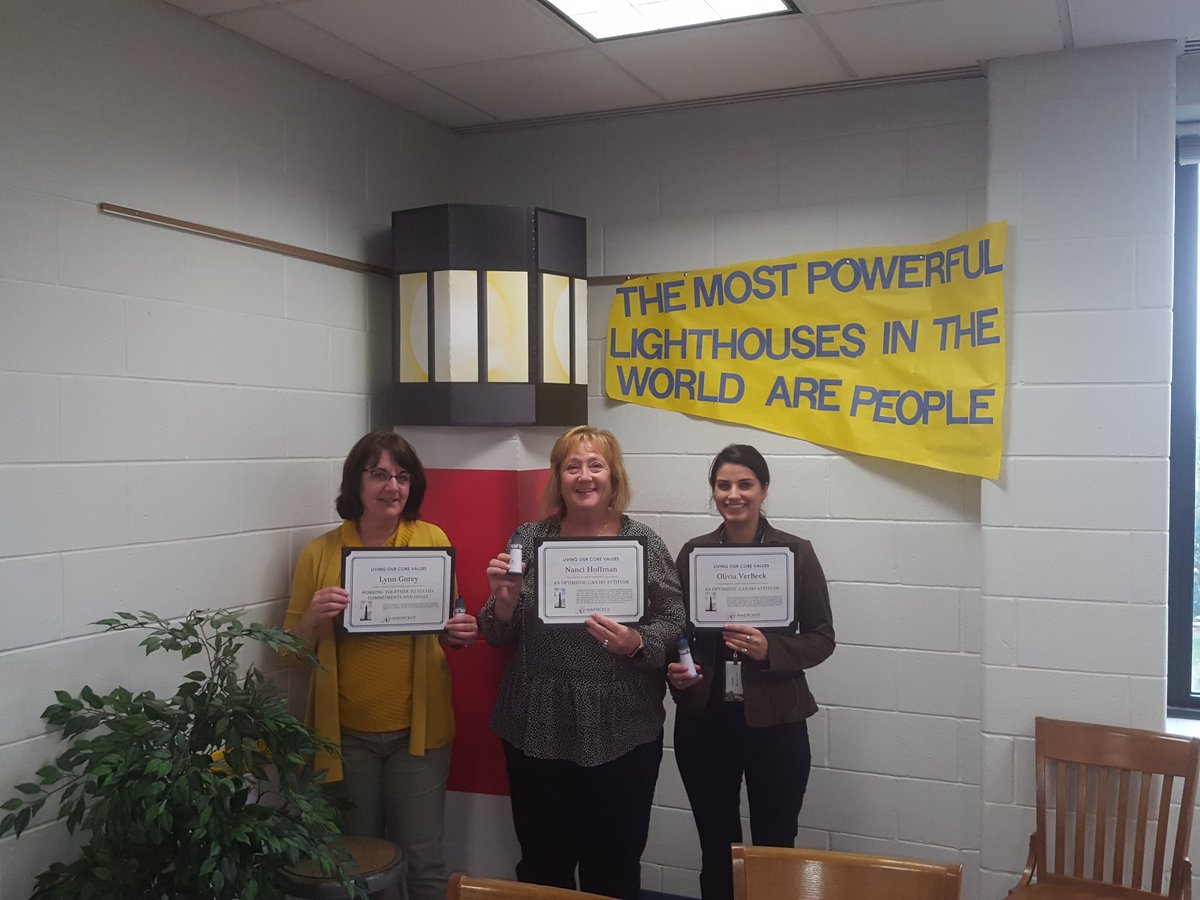 Maercker staff receiving awards from other staff for showing district core values. #d60learns