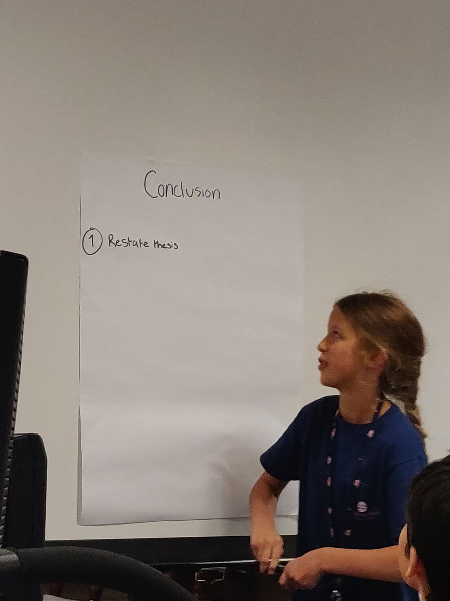 mrjackson_CMS's tweet photo. One of my students, Ms. Vinklarek, teaching the class how to write a conclusion to an expository essay. #creekwoodrocks #POG #coltsrcool #higherlevelthinking https://t.co/Csg7L7TiGn