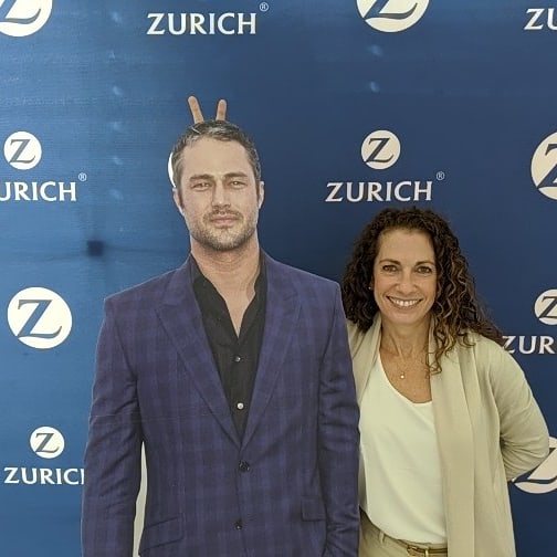 Zenfur's tweet photo. Flashback to that time when Chicago Fire invaded our building and I tried to give Taylor Kinney rabbit ears. #imtooshort #doover #IAmZurich #chicagofire @zurichna https://t.co/Wz34Q5Mk5b