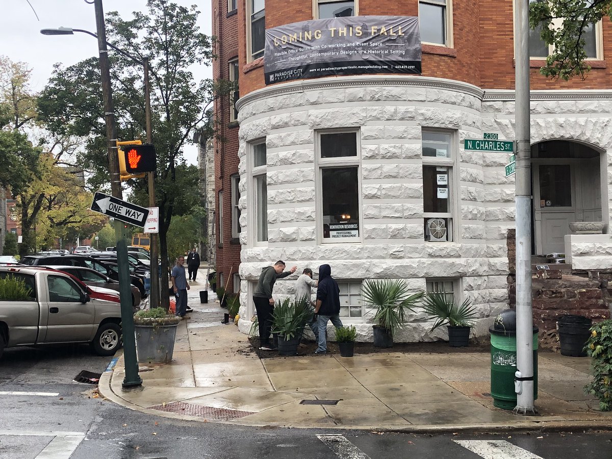 Kelly4Baltimore's tweet photo. Rain won’t stop my intrepid and infinitely talented husband as he landscapes the beer garden at Fadensonnen and outside the soon-to-open Dutch Courage at 23rd and Charles. All the concrete removed there will also give the street trees a new lease on life. https://t.co/ExBnwzDjP0