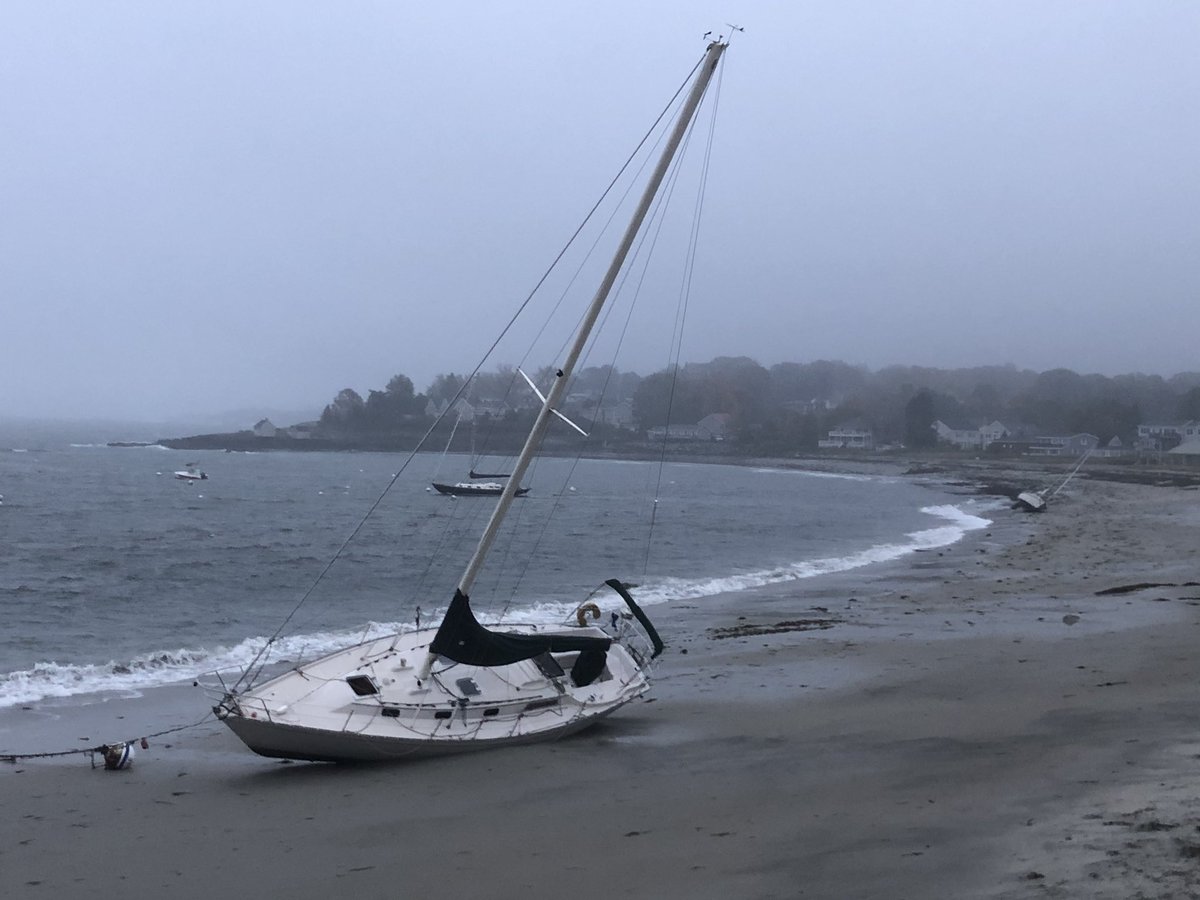 davidsdane's tweet photo. A nor’easter bringing high winds and rain  reveals boats on their bottoms at Willard Beach in South Portland! https://t.co/I4eFv6K8Xf