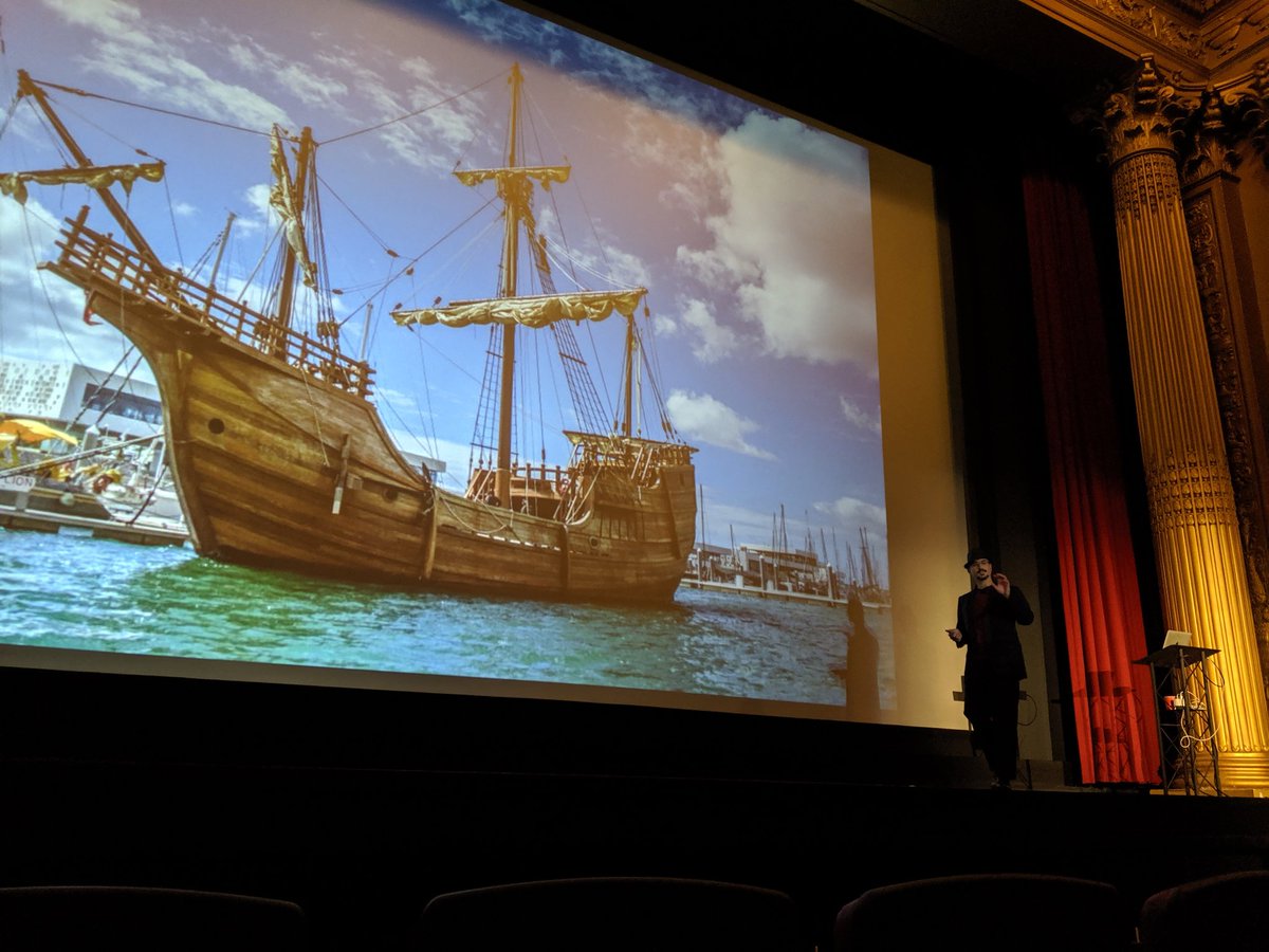 Casey Rosenthal talking about his work in resilience engineering with a sail boat in the background.
