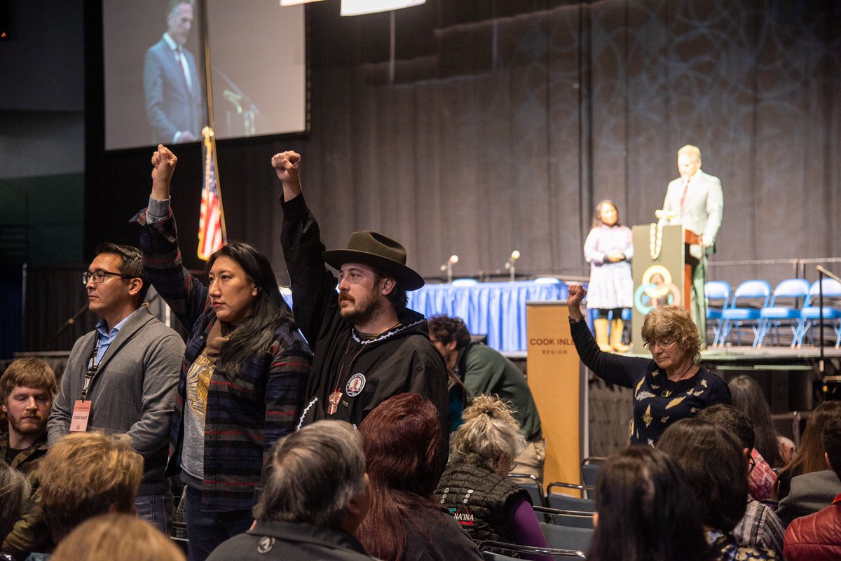 DefendAK's tweet photo. Peaceful Protesters disrupt Gov. Dunleavy’s remarks at AFN 2019 #defendthesacredAK #AlwaysIndigenousMedia #MicBackLandBack https://t.co/6pYC0oBbus