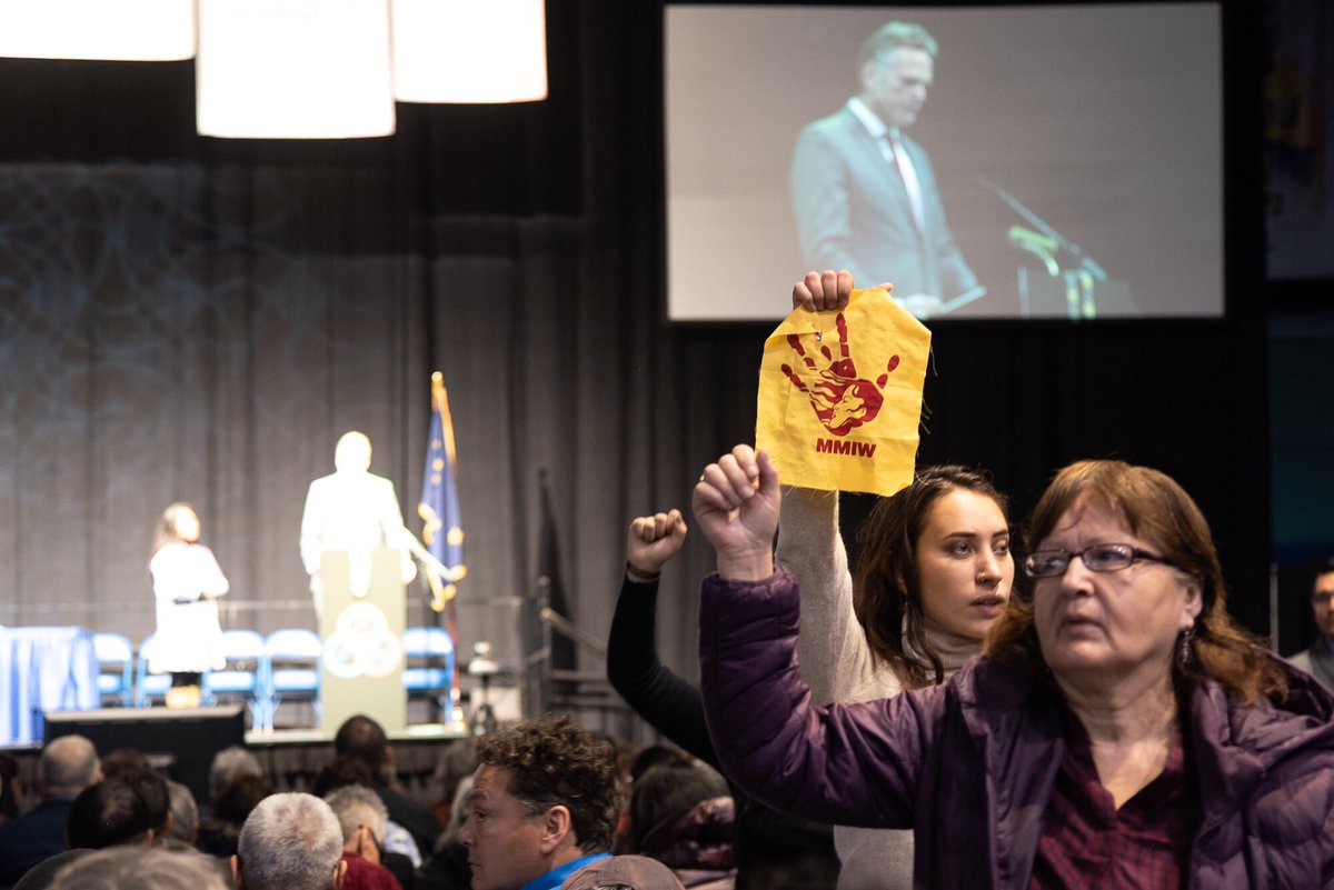 DefendAK's tweet photo. Peaceful Protesters disrupt Gov. Dunleavy’s remarks at AFN 2019 #defendthesacredAK #AlwaysIndigenousMedia #MicBackLandBack https://t.co/6pYC0oBbus
