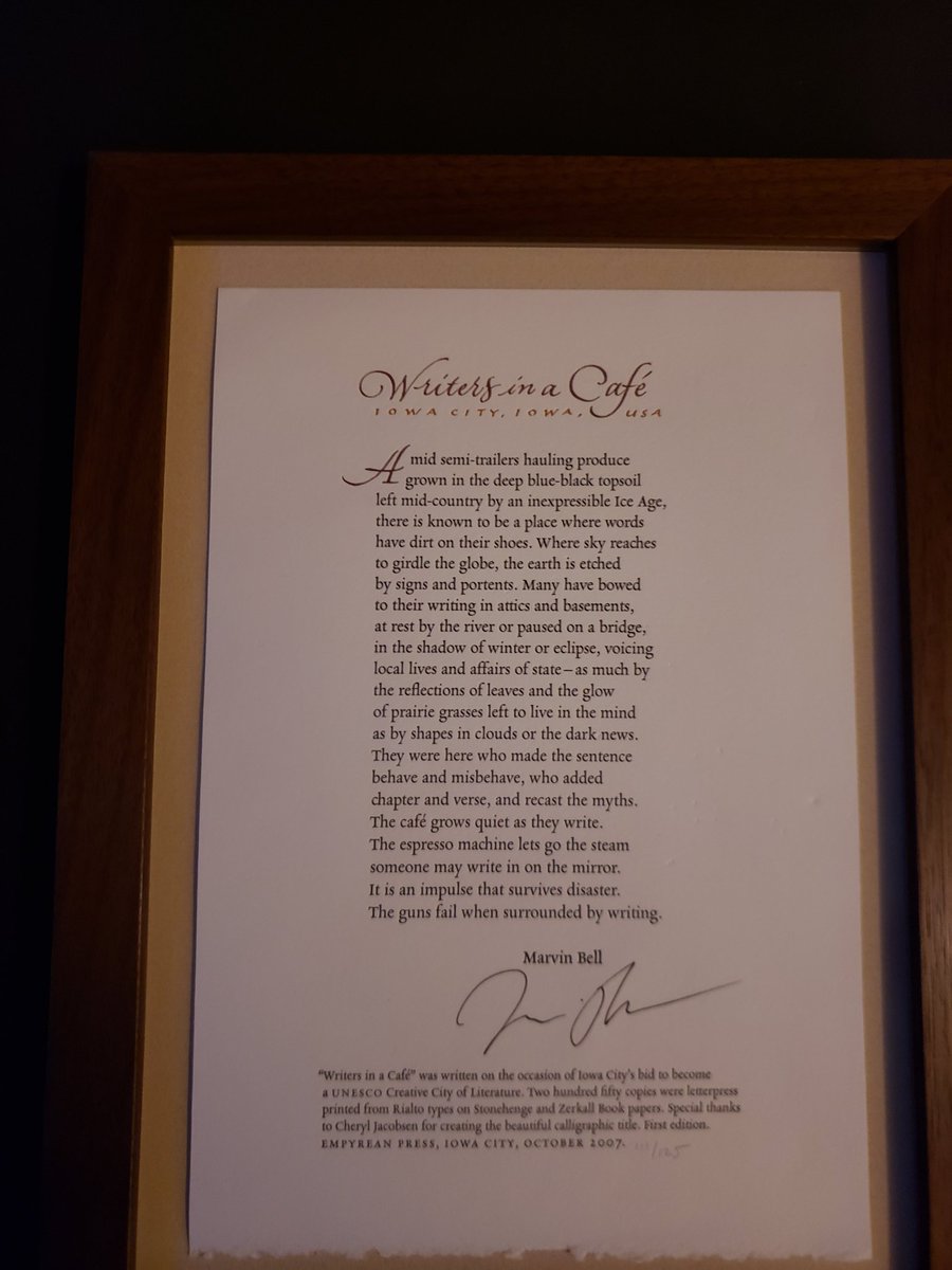 Framed copy of "Writers in a Cafe" by Marvin Bell, Poet Laureate.