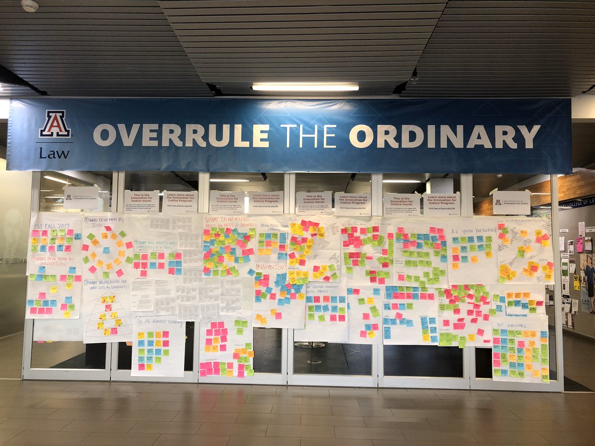stacyrjane's tweet photo. The #i4j mural is back in the lobby at @uarizonalaw - sharing our work-in-progress on this year’s challenge, meeting the needs of human trafficking survivors. Overheard: “I’m not sure what this is but i can tell everyone is engaged.” 🙃🦄🌵 https://t.co/Vw8KMDgf5j