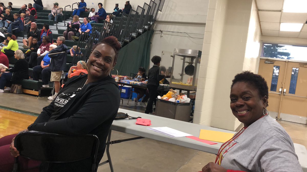 Family Engagement members  working family night at the JRE v-ball game.