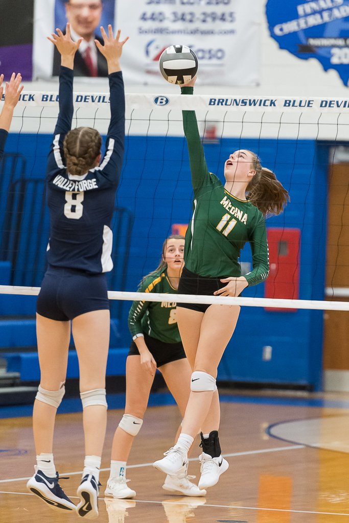 Medina's <a href="/gracemachalec/">Grace Machalec</a> gets the point against Valley Forge. <a href="/MedinaGrlsVball/">Coach Joe</a>