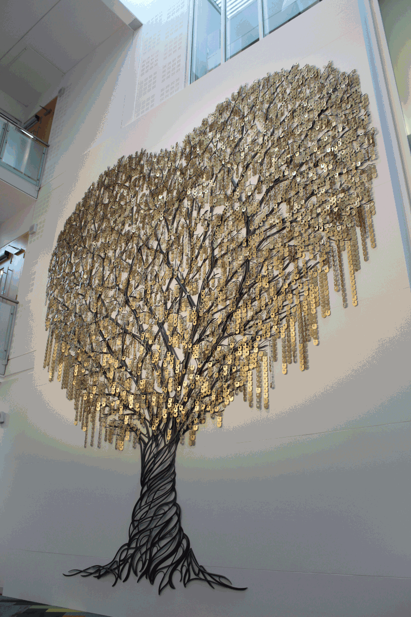 OpenUniversity's tweet photo. The Tree of Learning sculpture is now fully grown! 🌳

Complete with 7,000 shields from our generous alumni, who have donated enough to fund 15 carer scholarships! 💙

Find out more: https://t.co/Bt5ZgZod5I 

#OU50 #OUFamily https://t.co/yCnsnwh0Fs