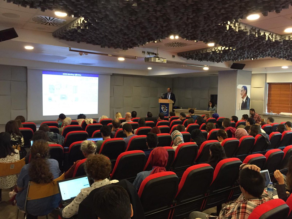 HIBIT_2019's tweet photo. Serdar Durdağı is on the stage now talking about "Integration of Machine Learning, Text Mining, Binary QSAR Models and Target-Driven Virtual Screening Approaches for the Identification of Novel Small Molecule Therapeutics". #hibit2019 https://t.co/J5DXbHaucA